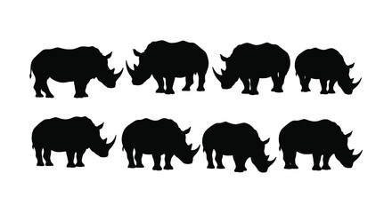 A group of rhinoceros silhouettes standing together