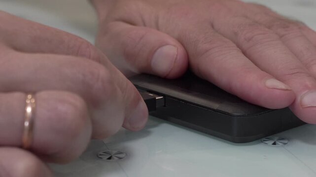 connecting usb cable to external hard drive, connecting high speed sdd drive on table, data storage, copying data to external storage media