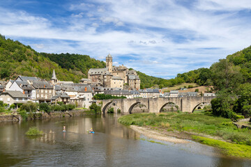 Fototapeta premium Estaing village castle and bridge spanning Lot river, Occitanie