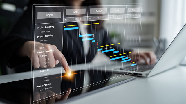 A professional businesswoman engages with a digital project management Gantt chart displayed on her laptop, highlighting tasks and timelines in a modern office setting. Tessel