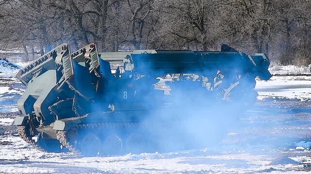 Military tracked vehicle with a large bucket, equipment of the engineering troops.