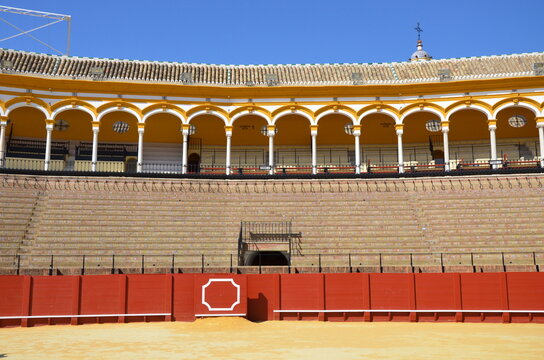 Seville, Spain 03.25.2019: Golden groomed sand and empty stands at the Seville bullfighting ring
