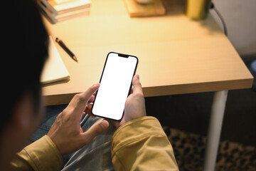 Man hands holding smart phone with blank screen for your text message or information