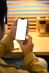 Man hands holding smart phone with blank screen for your text message or information