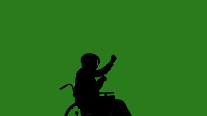 A black silhouette of a man in a wheelchair dancing while seated, against a green chroma key background. Minimalist contrast and modern visual composition, mockup.