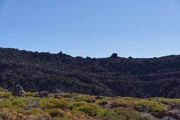 Solidified black lava river on Teide slopes