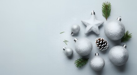 Elegant silver Christmas ornaments sparkle with festive holiday cheer and winter frost