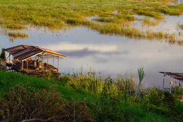 Rustic river hut and flooded grassland along the Mekong River, Vientiane, Laos