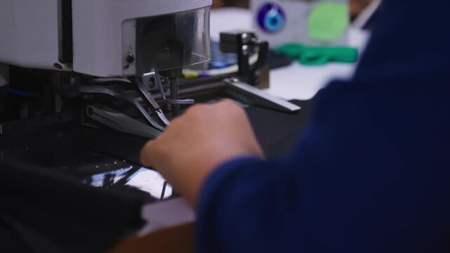 Industrial Sewing Machine in Action. Close-up Textile Factory Footage