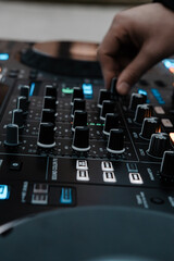 Close-up of colorful DJ controller with illuminated pads
