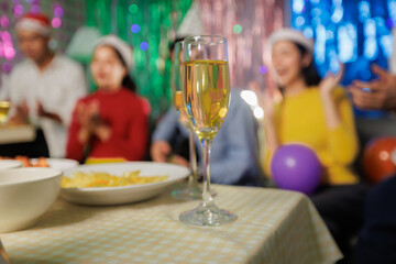 Friends and family gather for a joint holiday season toast and party.