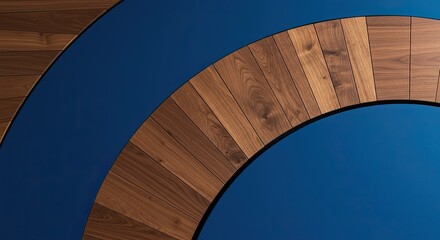 Obraz premium Abstract wooden curves against a bold blue backdrop emphasizing modern design elements