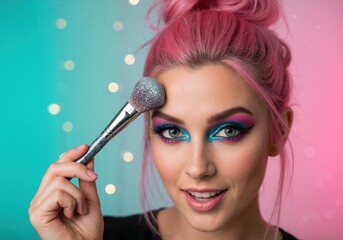 Close-up of a model with pink hair and creative colorful makeup. Young woman holding a glitter cosmetic brush. Beauty and fashion portrait