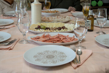 Festive lunch table with shrimp, cheese, and drinks set for a family gathering. Warm holiday meal and celebration atmosphere.