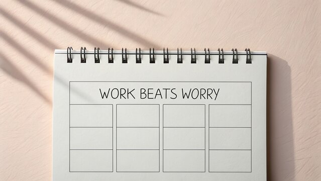 Minimalist calendar page featuring work beats worry inscription