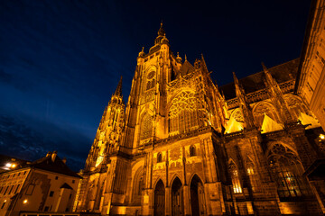 Saint Vitus Cathedral illuminating Prague Castle complex at night
