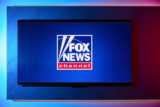 Usinsk, Russian Federation - November 07, 2025: Fox News Channel logo displayed on a modern television screen with vibrant blue and red lighting, showcasing media branding and contemporary design