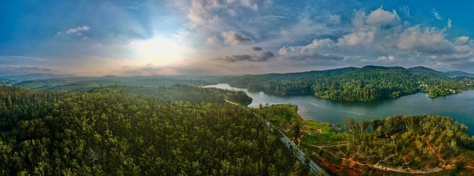 Aerial view of coastal peninsula and bay at sunset - Powered by Adobe