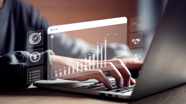 Cost control and budgeting concept with hands typing on laptop, displaying a graph of reduced expenses and increasing profit, representing financial planning and profit maximization strategy.