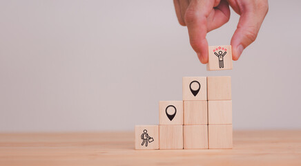 Arranging wooden blocks to map career growth and success strategies a visual guide to planning your future with leadership and motivation for effective development