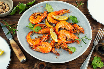 Grilled langoustines on wooden surface, luxury food.