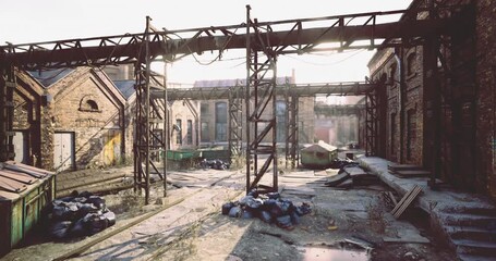 An abandoned industrial site features rusty structures and crumbling buildings, with overgrown plants and debris strewn across the ground, hinting at a once thriving location now left to nature. - Powered by Adobe