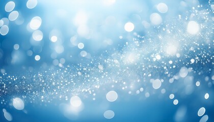 Obraz premium A Light Blue Background With A Sprinkle Of White Blurry Lights
