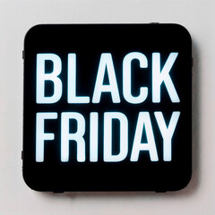 Black square sign with white ‘BLACK FRIDAY’ text isolated on gray wall