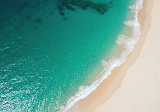 Stunning aerial top down view of a tropical paradise beach with crystal clear turquoise ocean water and white sand.