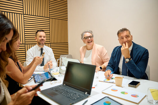 Business people having a lively meeting and laughing