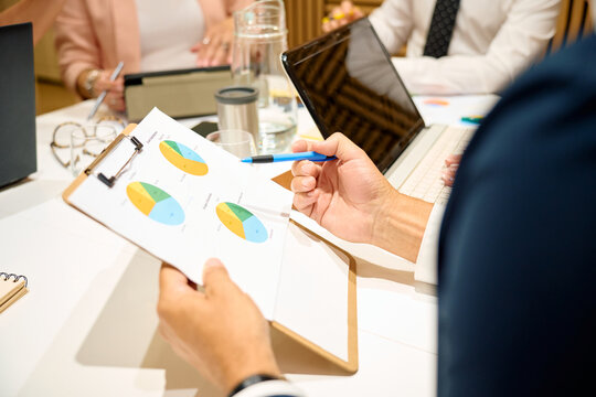 Business team analyzing data charts during a meeting