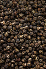 Fresh Black Tea Leaves with Dried Flowers and Fruit Macro Shot