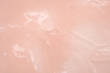 Fototapeta premium Pink lotion beauty skincare cream texture cosmetic product background