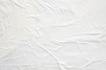 white crumpled and creased glued wrinkled paper poster texture background