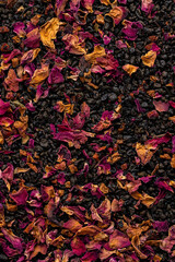 Fresh Black Tea Leaves with Dried Flowers and Fruit Macro Shot