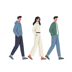 Three People Walking Together Side By Side In A Row Creating A Sense Of Unity And Movement In Their Casual Outfits With One Person In A Blue Hoodie Another In A White Jumpsuit And The Third In A