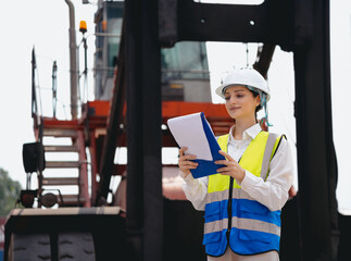 Industrial engineer standing at shipping container yard inspecting cargo delivering loading plan....