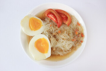 Boiled instant vermicelli are served in a bowl with a white background	
