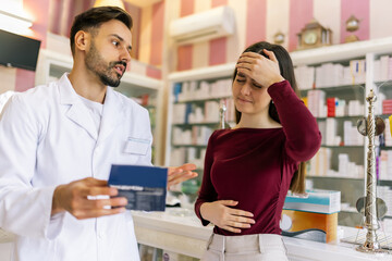 Woman receiving advice from pharmacist about headache medicine