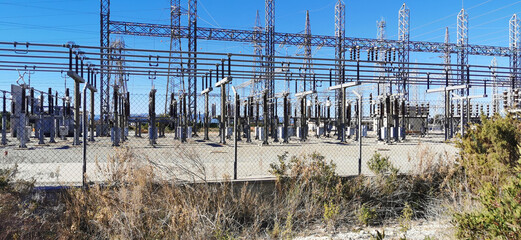 View of a large electrical substation, highlighting the complexity of its cables and structures