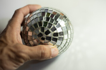 Mirror ball. A ball of small mirrors.