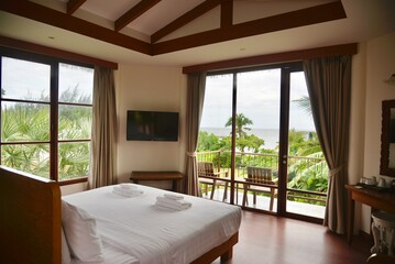 Seaman resort, Phetburi, Thailand, Oct 25,2025: the interior of a bright, comfortable hotel room with a stunning tropical sea view.