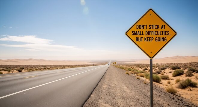 Yellow diamond road sign with motivational quote on a long desert highway. Perseverance concept, journey, travel, forward movement.