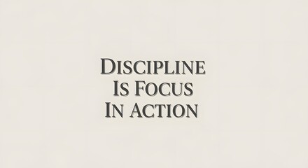A minimalist wall art featuring the motivational quote 'Discipline Is Focus In Action' in bold, black letters on a plain white background