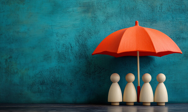 Wooden figures under a red umbrella in front of a teal background. Concept of protection and togetherness