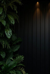 lush green plants beside sleek black wall illuminated by soft light
