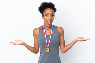 Young African American woman with medals isolated on white background with shocked facial expression