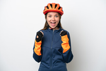 Young cyclist Lithuanian woman isolated on white background celebrating a victory in winner position
