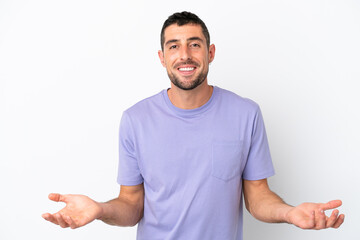 Fototapeta premium Young handsome caucasian man isolated on white background happy and smiling