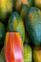 Background image of a beautiful red ripe papaya for use in cooking.